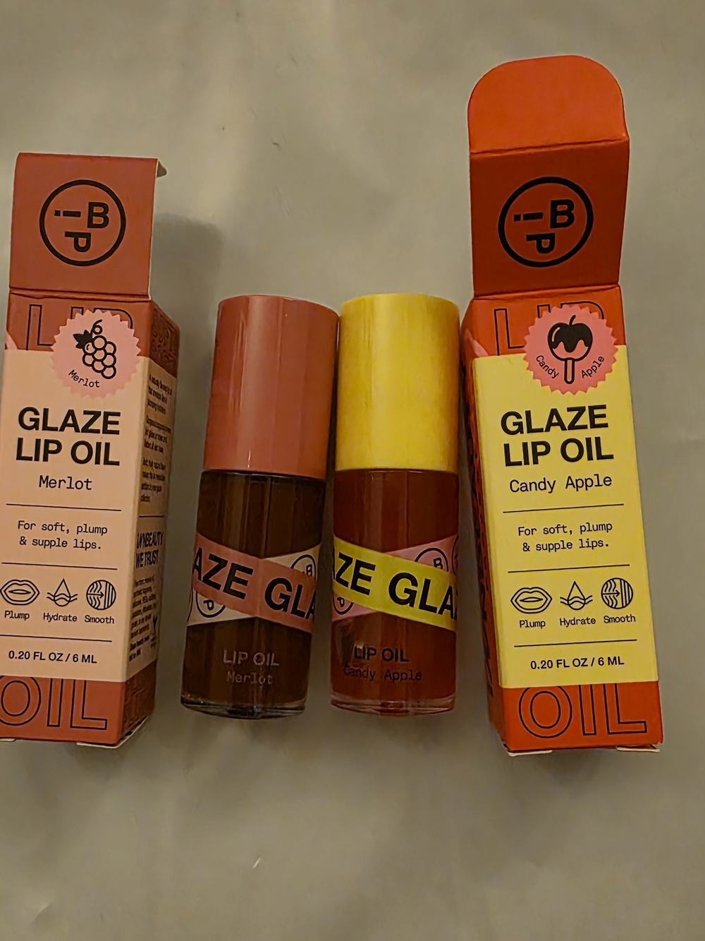 Glaze Lip Oil Duo - Merlot (plum) & Candy Apple (red)